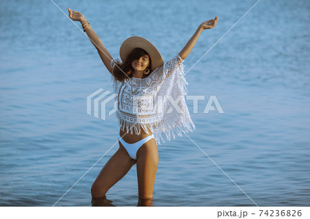 Woman Resting on the Beach During Vacations Woman Resting on the Beach During Vacations 74236826