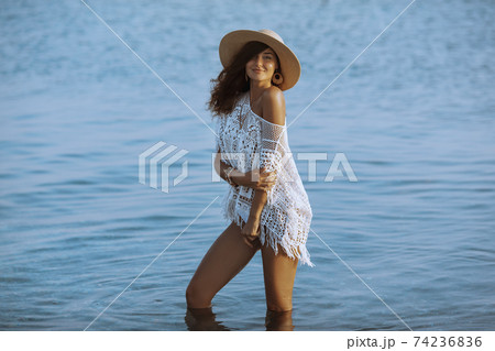 Woman Resting on the Beach During Vacation Woman Resting on the Beach During Vacation 74236836
