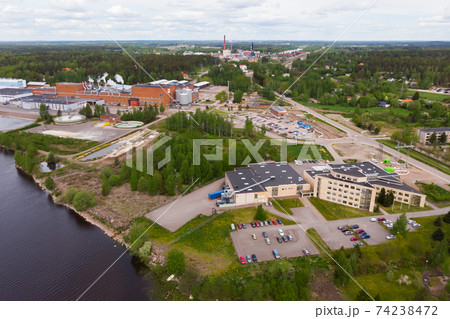 Aerial panoramic view of factory in city Inkeroinen at river Kymijoki, Finland. Aerial panoramic view of factory in city Inkeroinen at river Kymijoki, Finland. 74238472