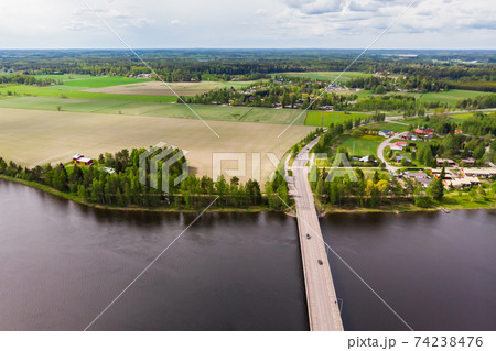 Aerial panoramic view of bridge in city Inkeroinen at river Kymijoki, Finland. 74238476