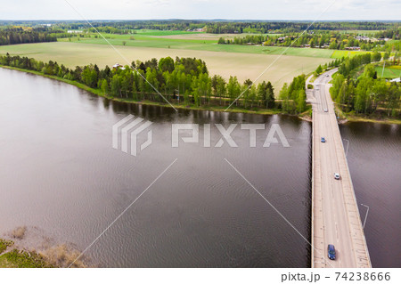 Aerial panoramic view of bridge in city Inkeroinen at river Kymijoki, Finland. Aerial panoramic view of bridge in city Inkeroinen at river Kymijoki, Finland. 74238666