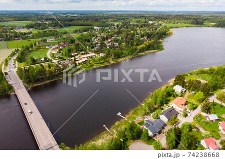 Aerial panoramic view of bridge in city Inkeroinen at river Kymijoki, Finland. Aerial panoramic view of bridge in city Inkeroinen at river Kymijoki, Finland. 74238668