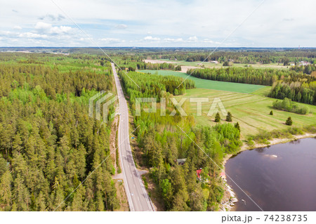 Aerial panoramic view of road in Kouvola near the river Kymijoki, Finland. Aerial panoramic view of road in Kouvola near the river Kymijoki, Finland. 74238735