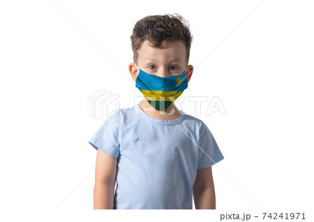 Respirator with flag of Rwanda. White boy puts on medical face mask isolated on white background 74241971