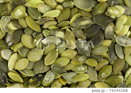 Pumpkin seeds background. Green pepita seeds. Top view. 74244208