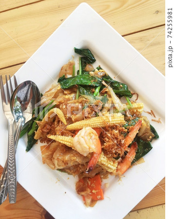 noodles with shrimp and vegetables cooked in Thai style. noodles with shrimp and vegetables cooked in Thai style. 74255981