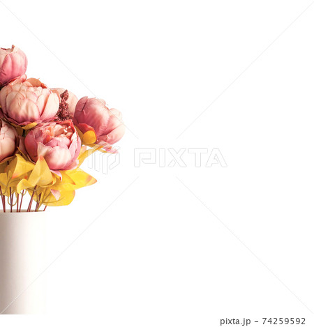 bouquet of artificial flower on white. Artificial peonies flowers in ceramic vase. Copy space. place for text or content 74259592