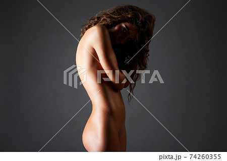 Female Silhouete. Naked girl in shadow Female Silhouete. Naked girl in shadow 74260355