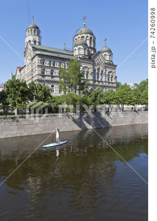 Sap Surfing on the Karpovka River opposite St. John's Convent in St. Petersburg Sap Surfing on the Karpovka River opposite St. John's Convent in St. Petersburg 74260998
