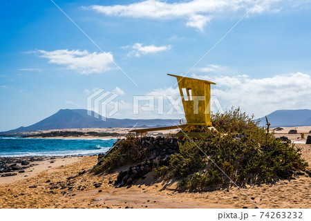 Lifeguard yellow hut in the beach of Corralejo in Fuerteventura, Canary Islands, Spain Lifeguard yellow hut in the beach of Corralejo in Fuerteventura, Canary Islands, Spain 74263232