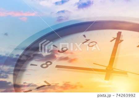 Clock face overlay with beautiful sunrise sky for good times working morning a new day concept. Clock face overlay with beautiful sunrise sky for good times working morning a new day concept. 74263992