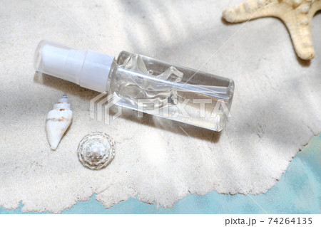 after sun moisturising gel on a sand under the water. after sun moisturising gel on a sand under the water. 74264135