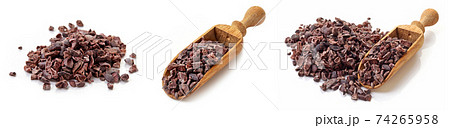 Heap of cacao nibs on white background Heap of cacao nibs on white background 74265958