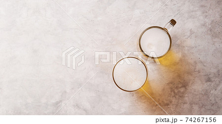Two Glass of Beer on Table. Couple or Two Friends Drinking Beer Concept. Happy Hours, Hangout or Celebrate in Restaurant and Bar, For Oktoberfest or any Cheerful Event. Top View 74267156