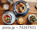 Healthy breakfast with chia strawberry pudding, oatmeal bowl and a cup of cappuccino 74267431