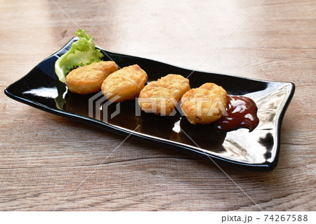 fried chiken nugget meat dipping ketchup on plate fried chiken nugget meat dipping ketchup on plate 74267588