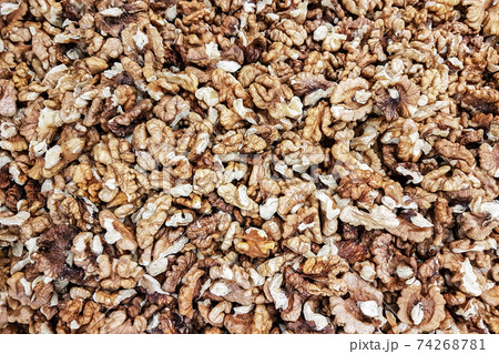 Background of shelled dried walnuts in close-up (high details) 74268781