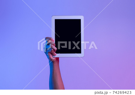 Male African American Hand Holding Digital Tablet With Black Screen, Neon Lighting Male African American Hand Holding Digital Tablet With Black Screen, Neon Lighting 74269423