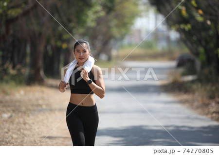 runner - woman running outdoors training for marathon run
