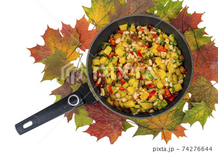 Frying pan with vegetable stew with pumpkin and white beans 74276644