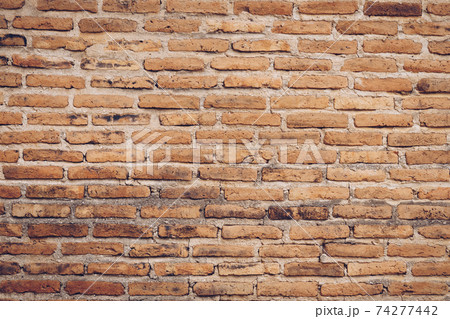 Old brown color brick wall for brickwork background and texture. 74277442