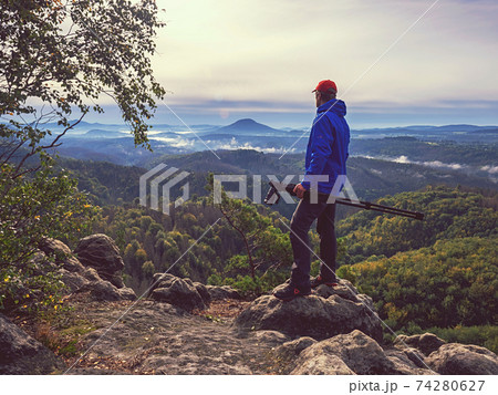 Professional photographer watches spring orange pink misty sunrise Professional photographer watches spring orange pink misty sunrise 74280627