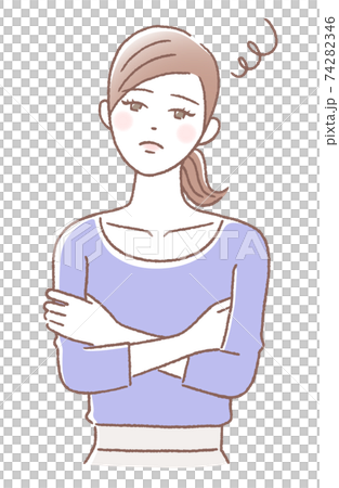 A woman with a troubled face with her arms folded A woman with a troubled face with her arms folded 74282346