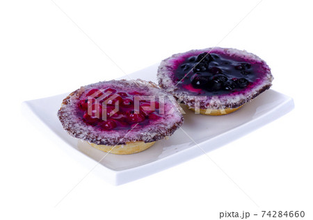 Sand baskets with sweet berries and jelly on white background. Studio Photo 74284660