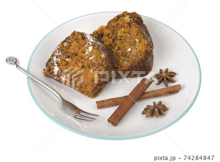 Piece of carrot cupcake on plate isolated on white 74284847