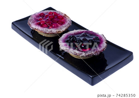 Sand baskets with sweet berries and jelly on white background. Studio Photo 74285350