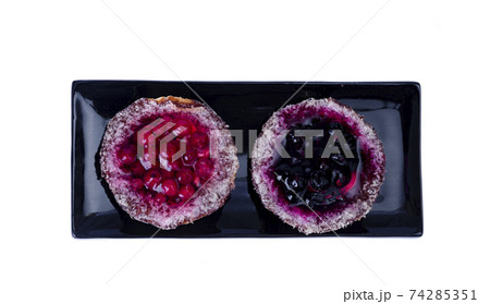 Sand baskets with sweet berries and jelly on white background. Studio Photo 74285351