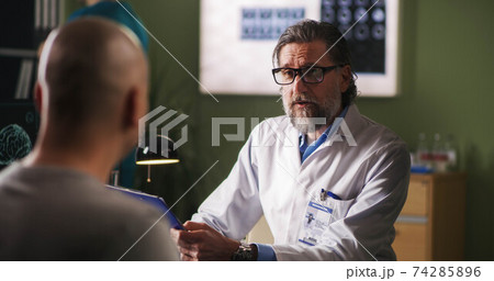 Oncology patient meeting with doctor in clinic Oncology patient meeting with doctor in clinic 74285896