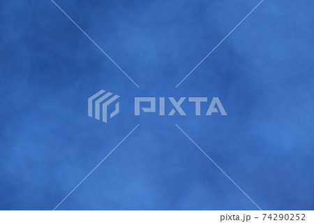 Blue bokeh background. Abstract background and texture with copy space. Vertical orientation. 74290252