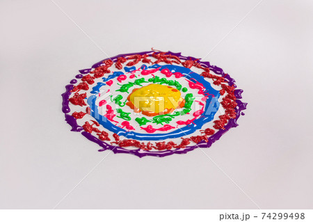 Colors drop onto a spinning white background. Colors drop onto a spinning white background. 74299498