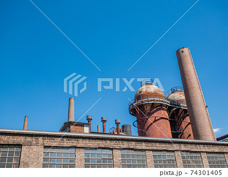 Very old brick industrial plant with steel tanks Very old brick industrial plant with steel tanks 74301405