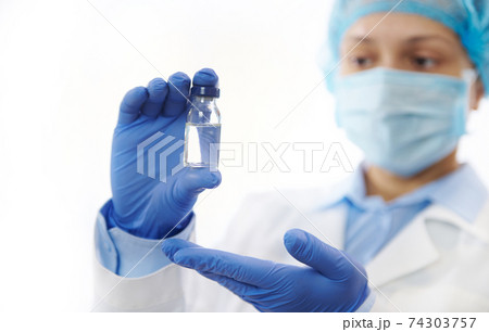 Closeup. Doctor holding a vaccine. Fighting Infectious Diseases. Immunization concept. 74303757