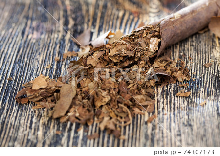 tobacco from a crumbling cigarette tobacco from a crumbling cigarette 74307173