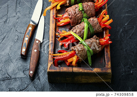 Stuffed beef rolls on cutting board 74309858