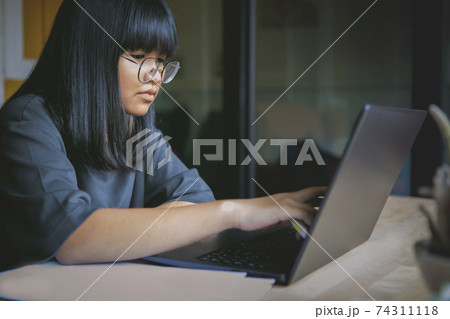 asian teenager studying online at home while outbreaking of covid-19 asian teenager studying online at home while outbreaking of covid-19 74311118