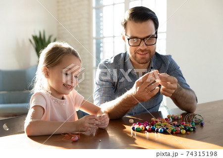 Happy dad play with cute small daughter Happy dad play with cute small daughter 74315198