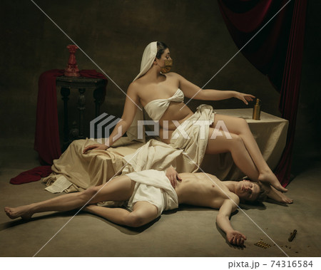 Modern remake of classical artwork with coronavirus theme - young medieval couple on dark background 74316584