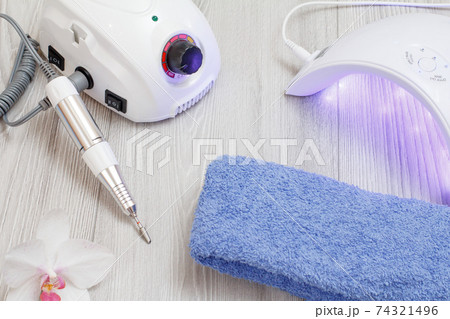 A set of cosmetic tools on a gray wooden background. A set of cosmetic tools on a gray wooden background. 74321496