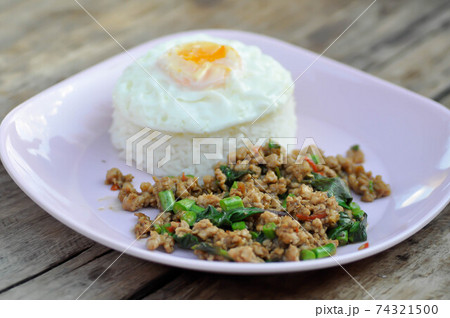 stir fried pork with holy basil and cow pea, fried egg and rice stir fried pork with holy basil and cow pea, fried egg and rice 74321500