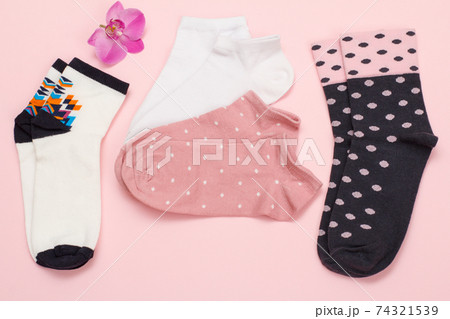 Women socks on pink background. Top view. Women socks on pink background. Top view. 74321539
