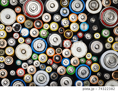 Used batteries toxic waste recycling and ecology issues concept background Used batteries toxic waste recycling and ecology issues concept background 74322382