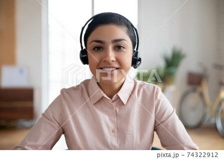 Happy teacher conducting online class from home Happy teacher conducting online class from home 74322912