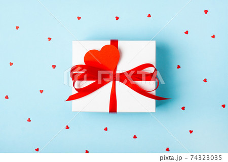 Attractive gift on the blue background 74323035