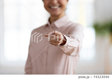 Hand of business woman pointing finger at camera 74323040