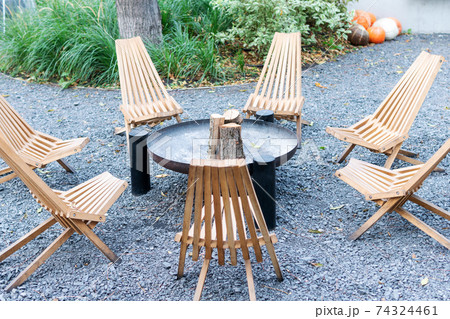 empty chairs around the fireplace empty chairs around the fireplace 74324461
