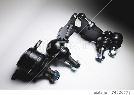 Kit set New spare parts axel car elements. off-road Ball joint car suspension on a gray background. Kit set New spare parts axel car elements. off-road Ball joint car suspension on a gray background. 74326575